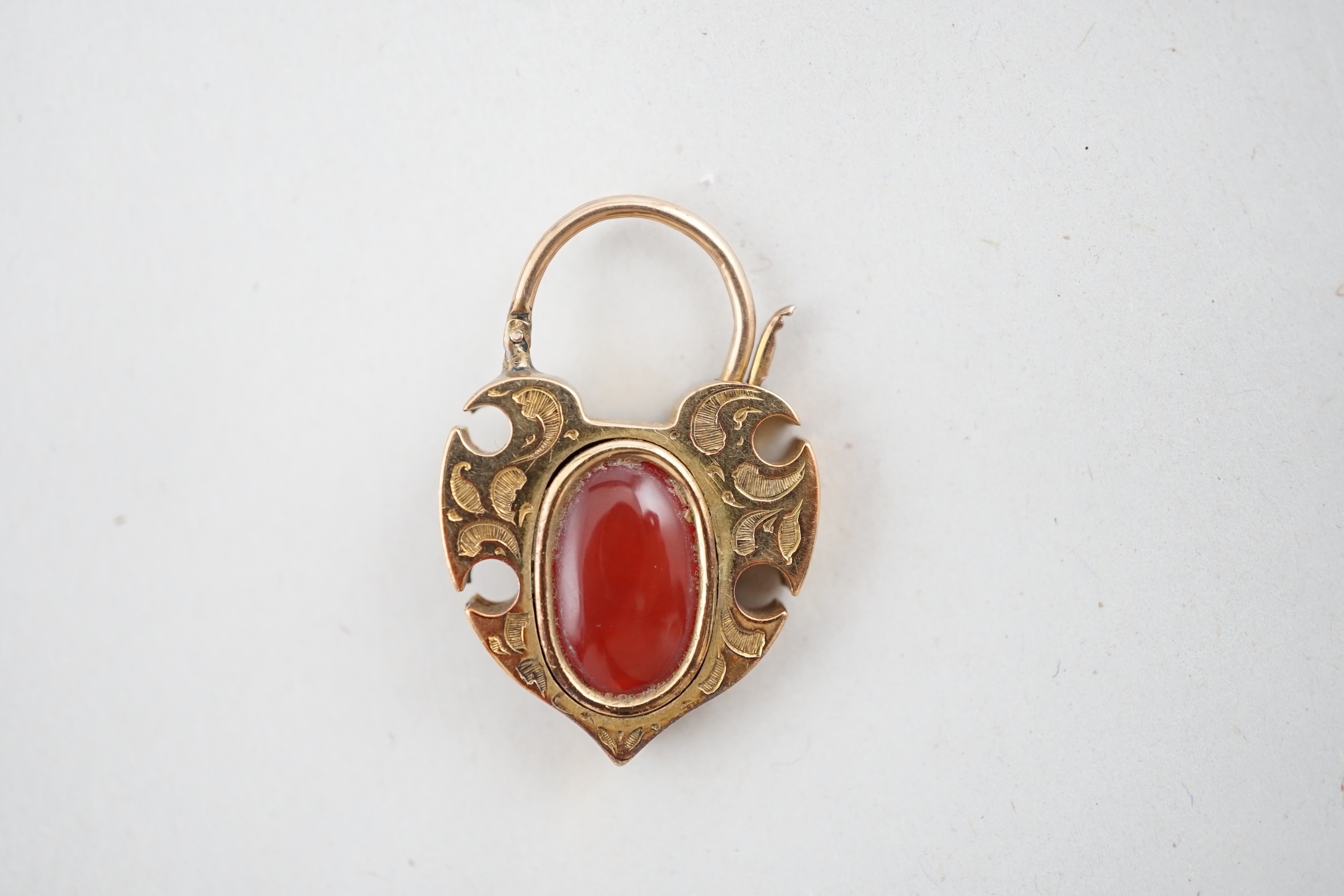 A Victorian engraved gold, carnelian and five stone rose cut diamond set padlock pendant